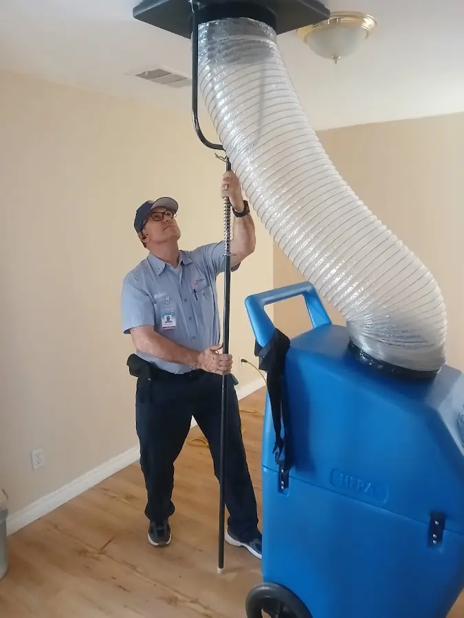 Furnace Tune-Up technician using HEPA equipment in Corvallis